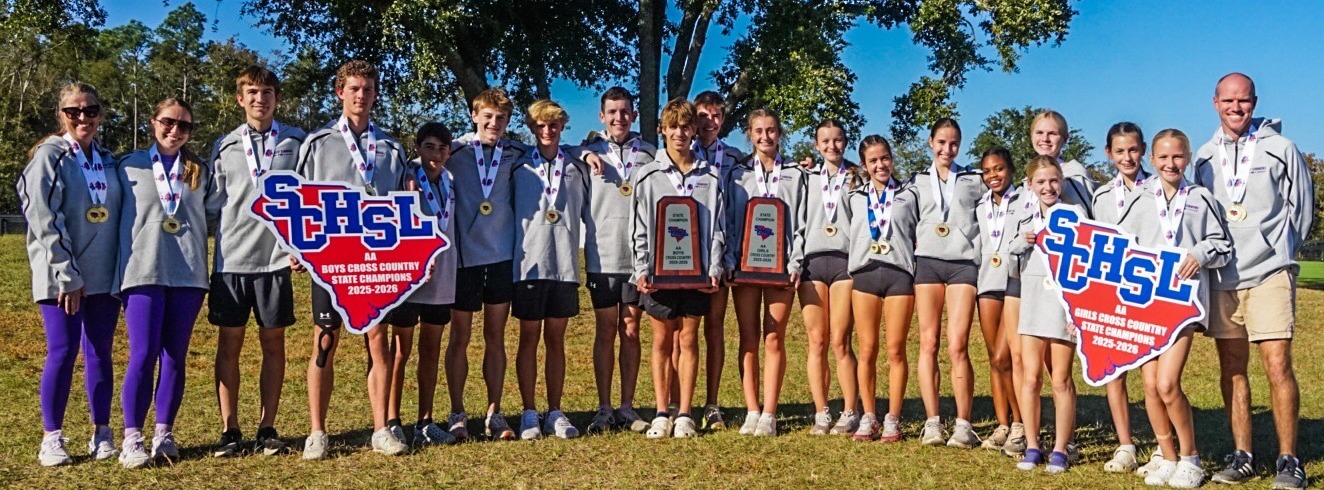football players reading to students