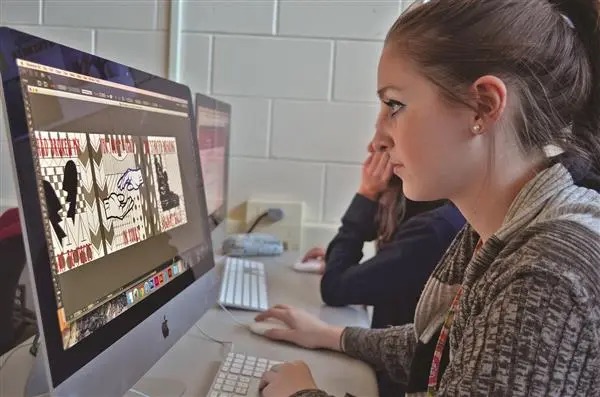 Woman looking at a computer