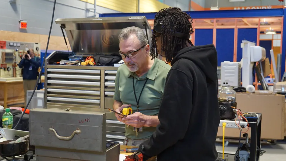 Teacher working with student