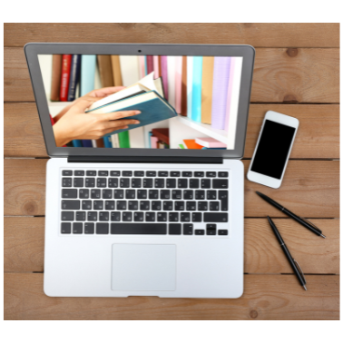 image of hands holding a book on a laptop screen