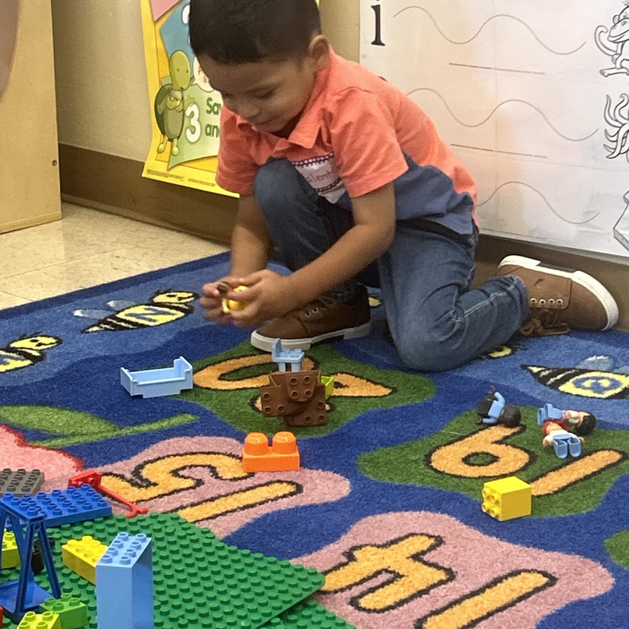 Child playing with more lego sets
