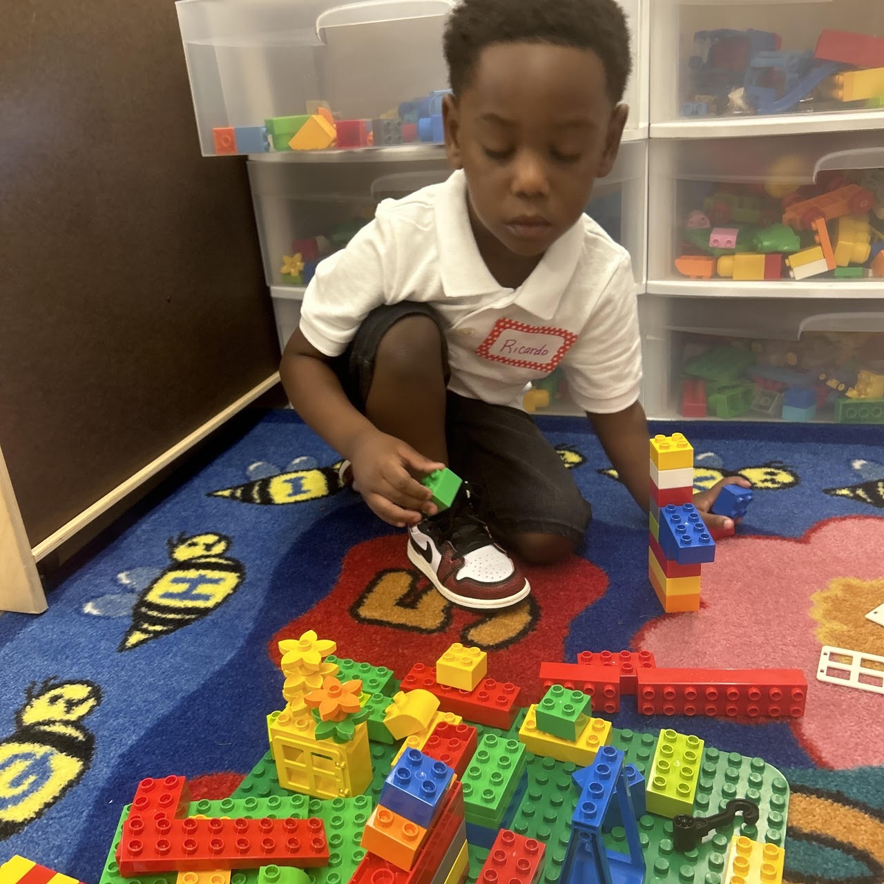 Child playing with a lego set