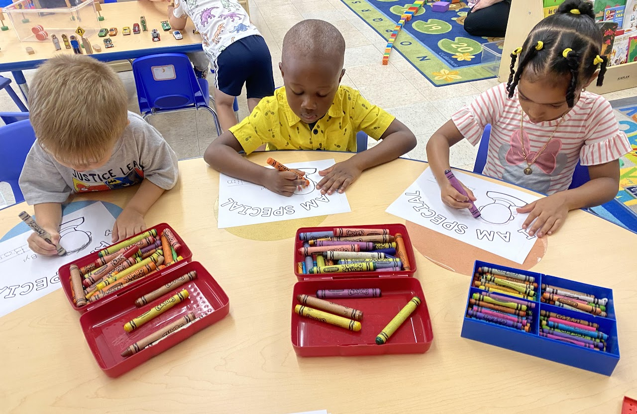 Three Children playing with crayons