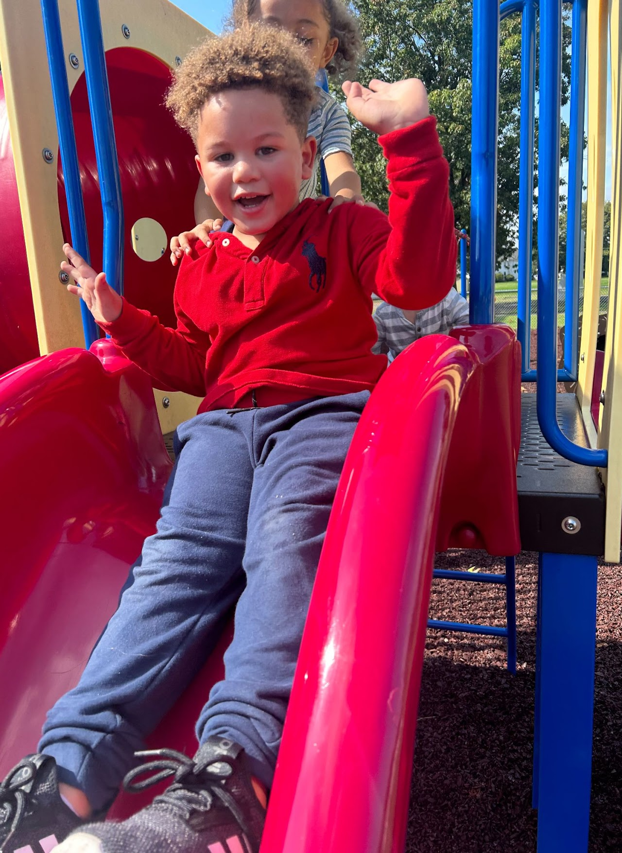 A picture of a child on a slide