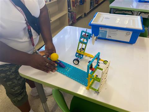 student with lego on the table