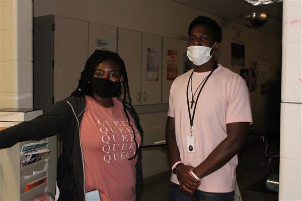 2 persons  wearing a face mask