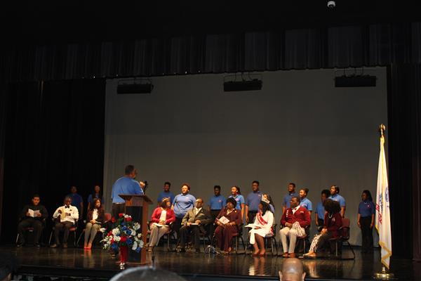 Students performing on stage 