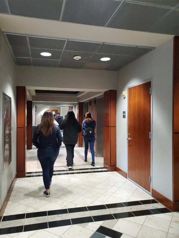 students walking through a hall 