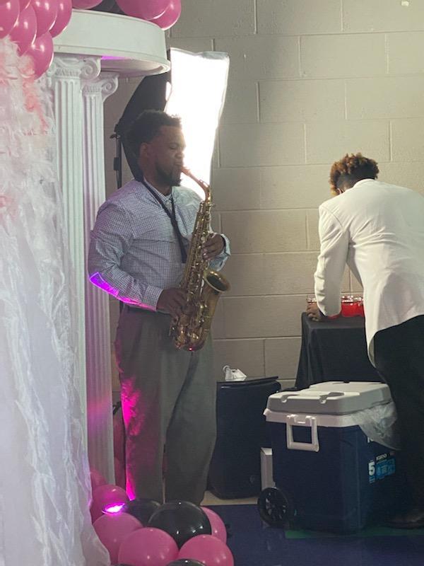 man playing the saxophone 