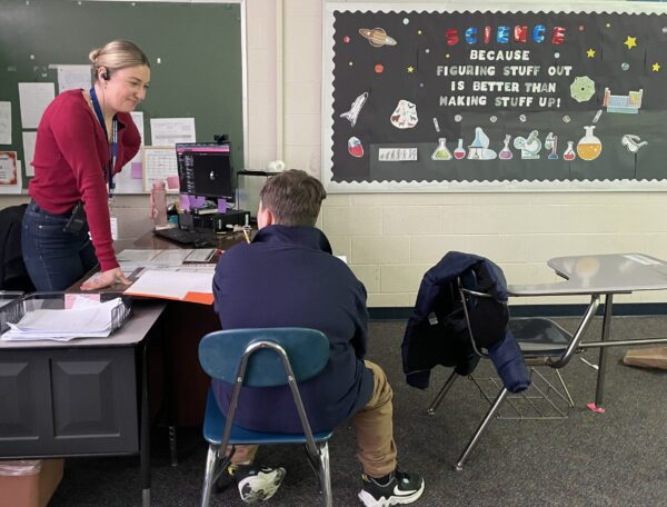 Teacher talking with student