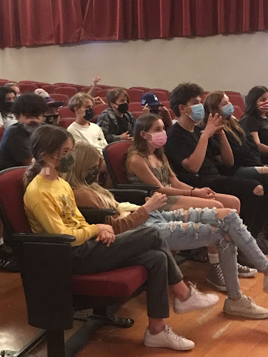 students sitting in theater