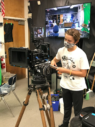 student working a camera