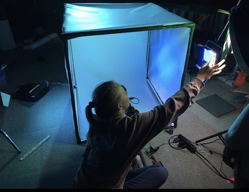 student with light box