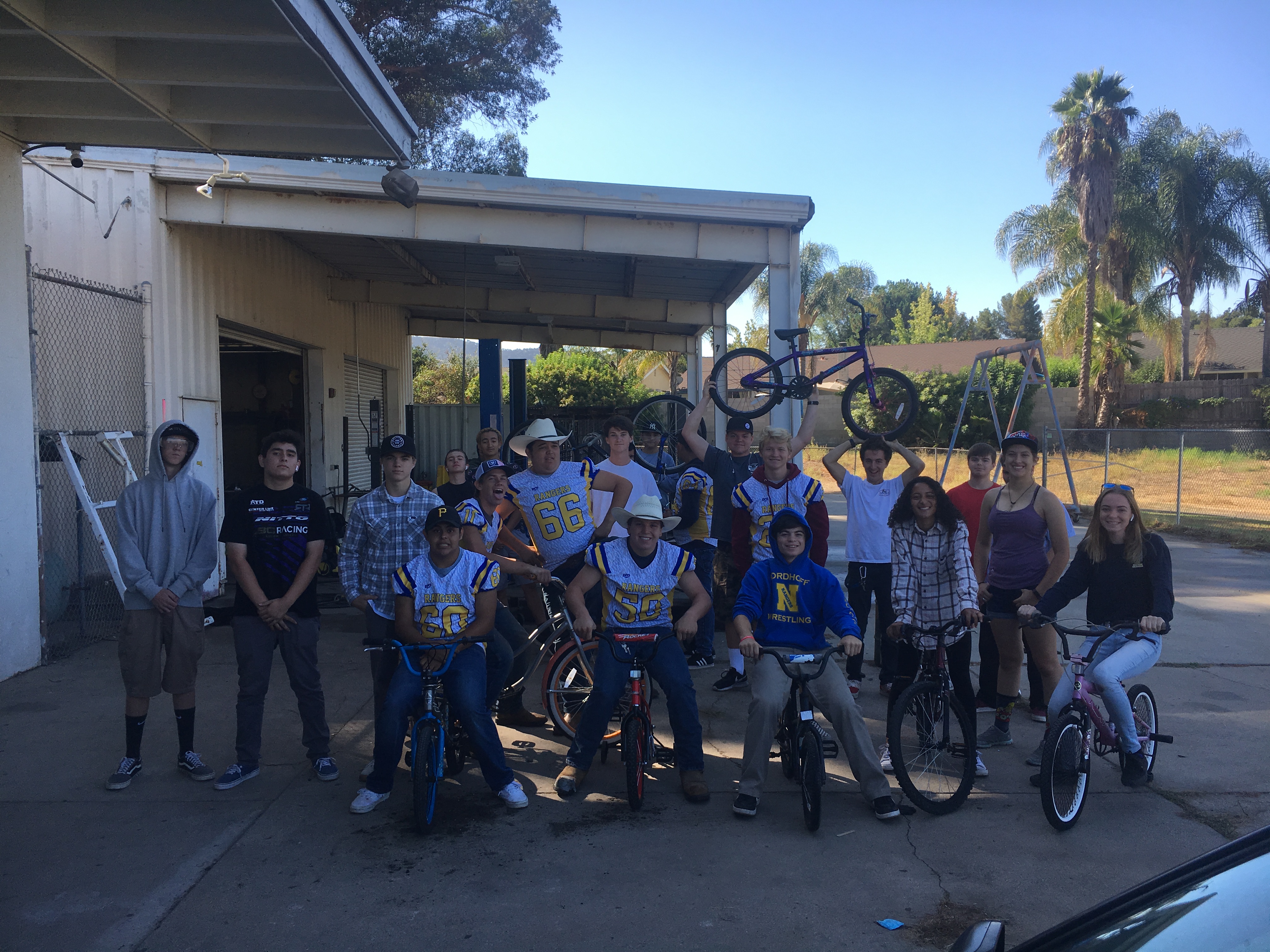 class photo with bikes