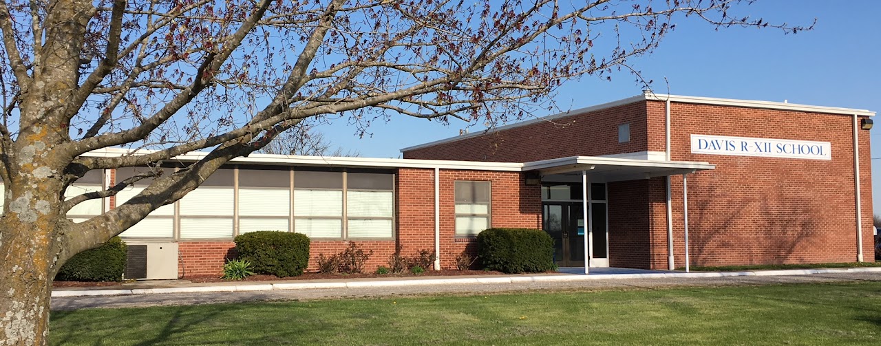 front of school building in the fall 