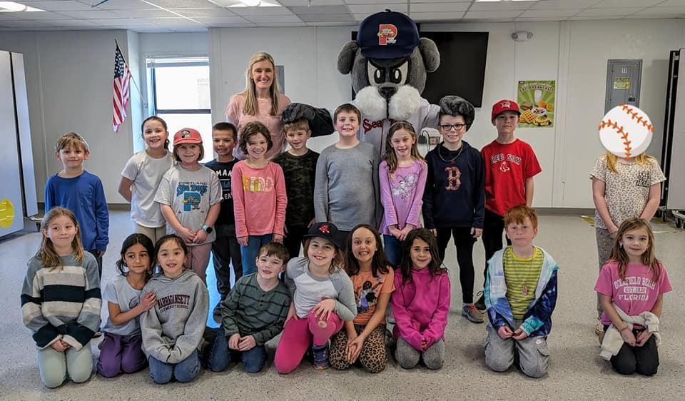 A group of children and adults posing for a picture