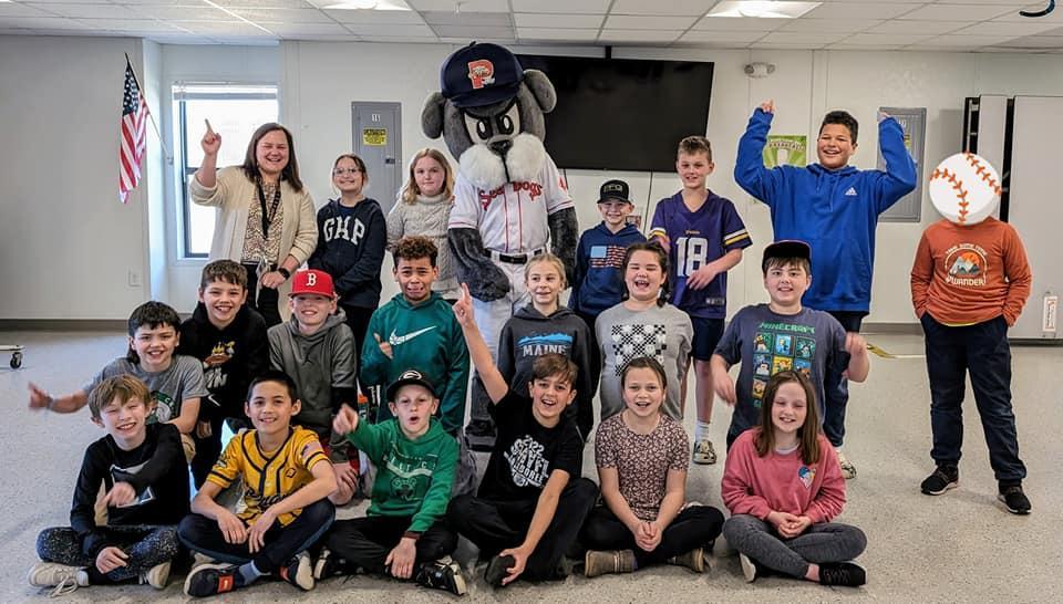 A group of children and adults posing for a picture