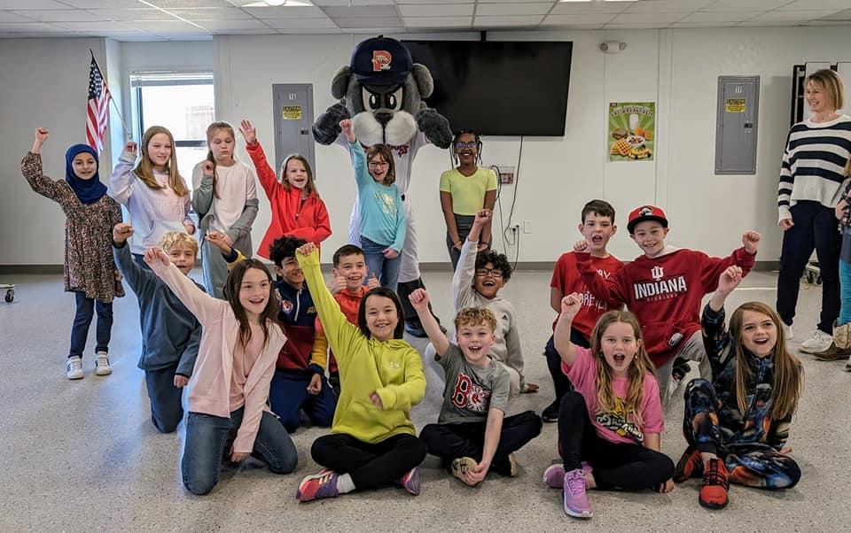 A group of children and adults posing for a picture