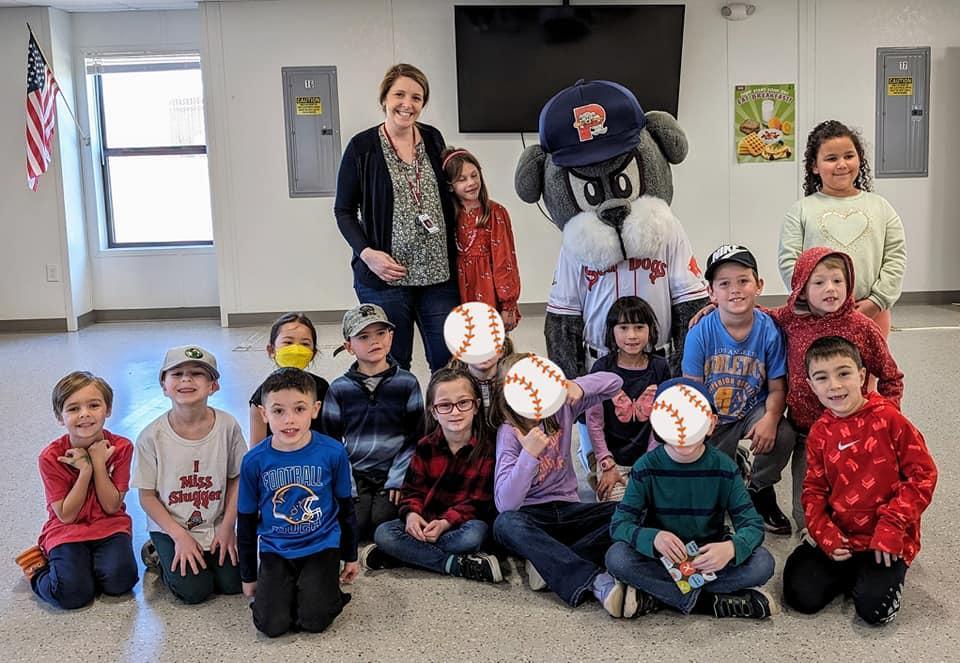 A group of children and adults posing for a picture