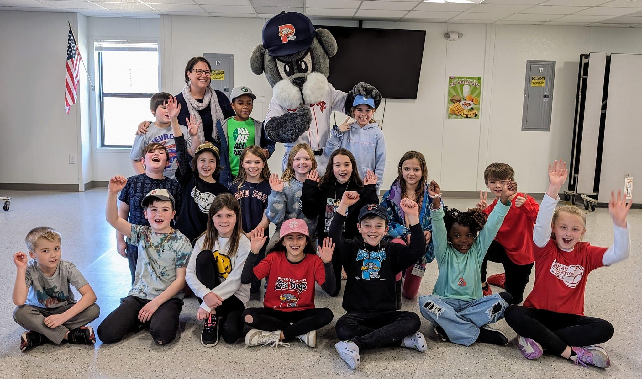 A group of children and adults posing for a picture