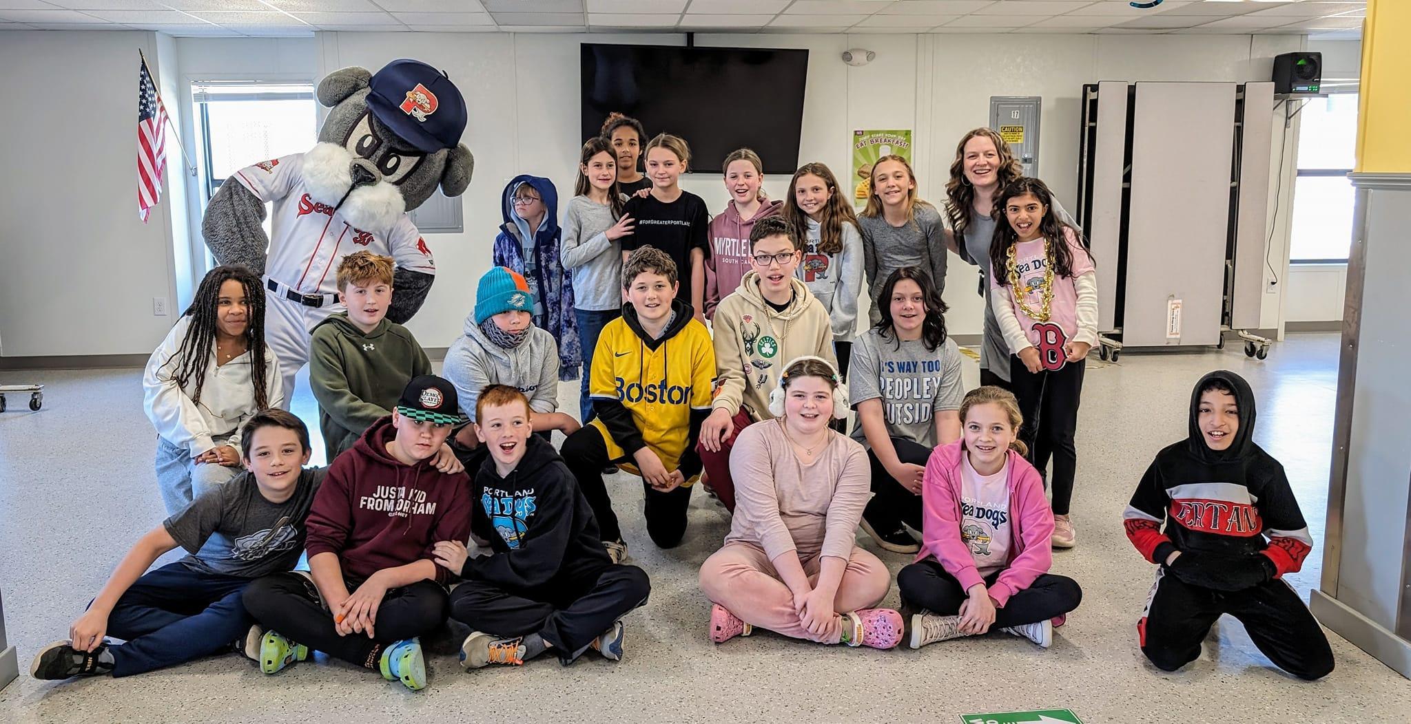 A group of children and adults posing for a picture