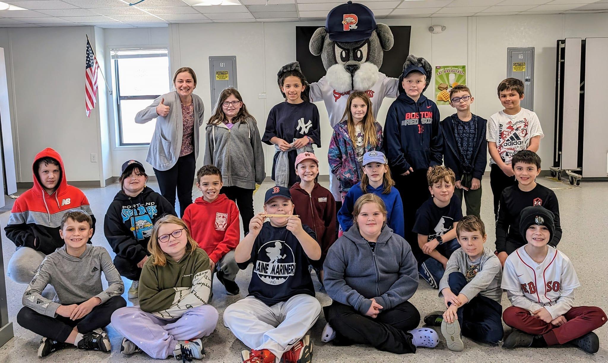 A group of children and adults posing for a picture