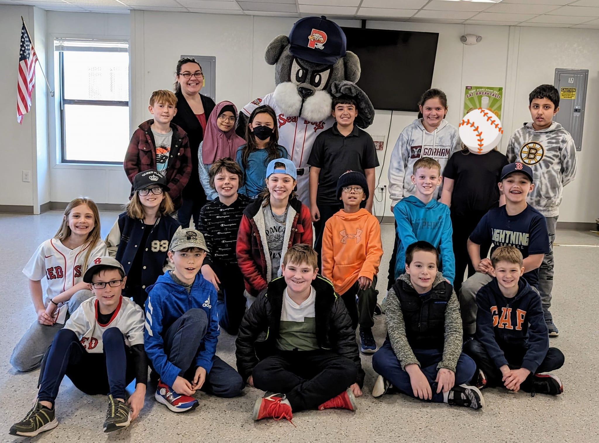 A group of children and adults posing for a picture