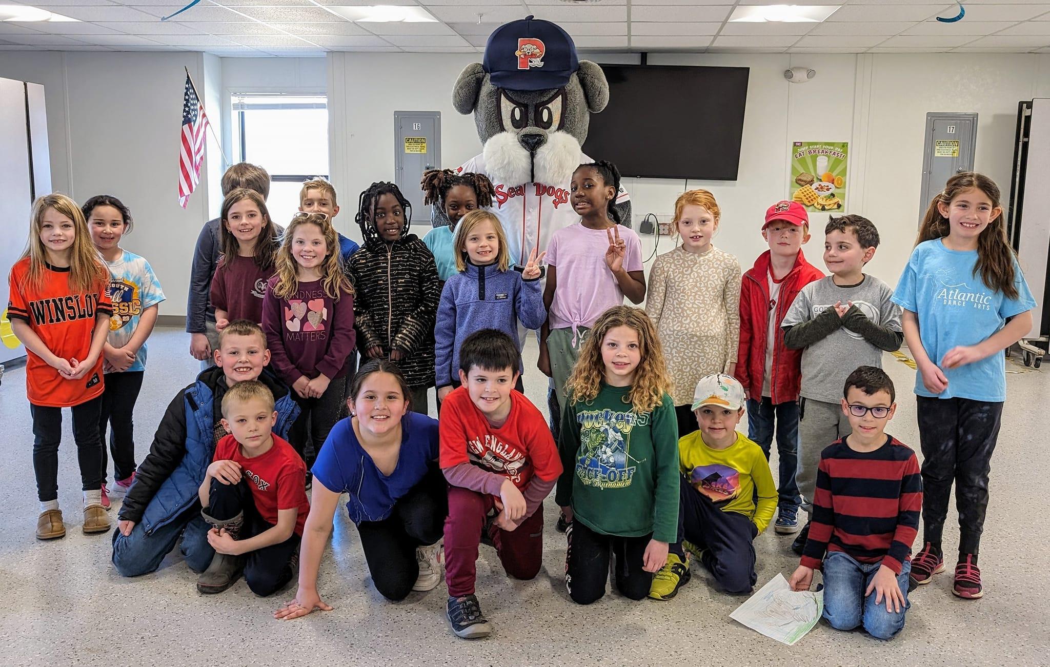 A group of children and adults posing for a picture