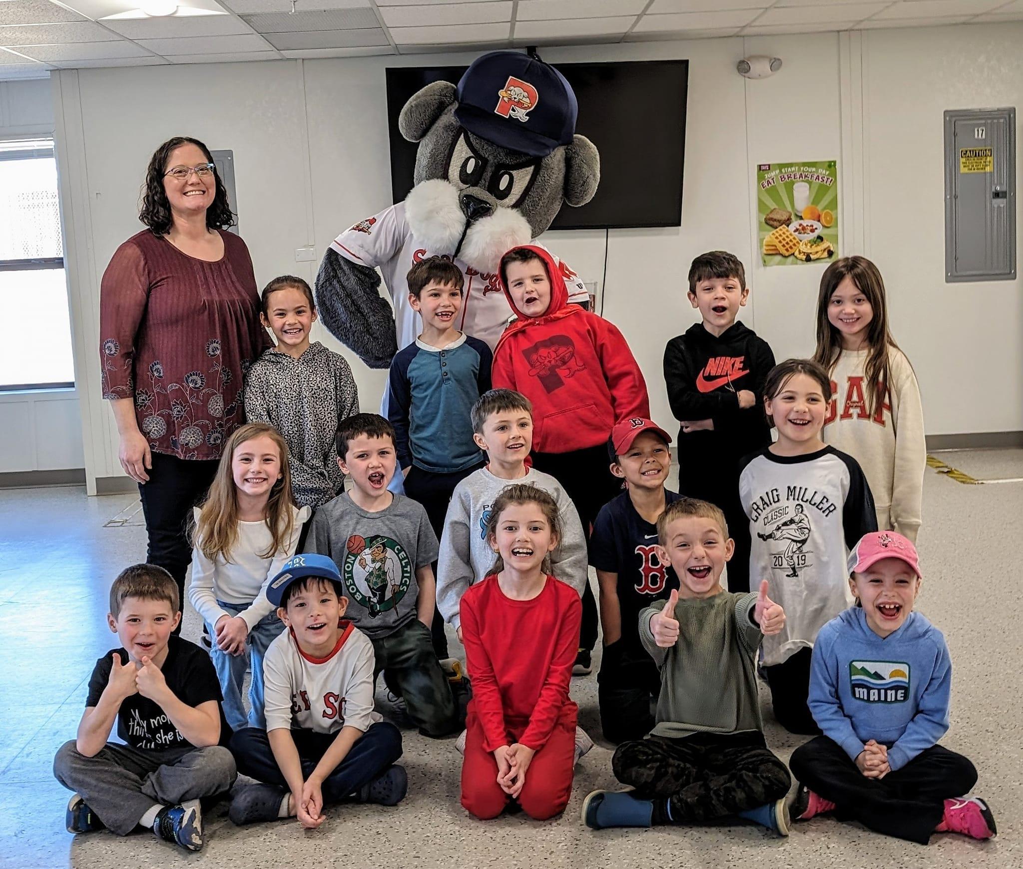 A group of children and adults posing for a picture