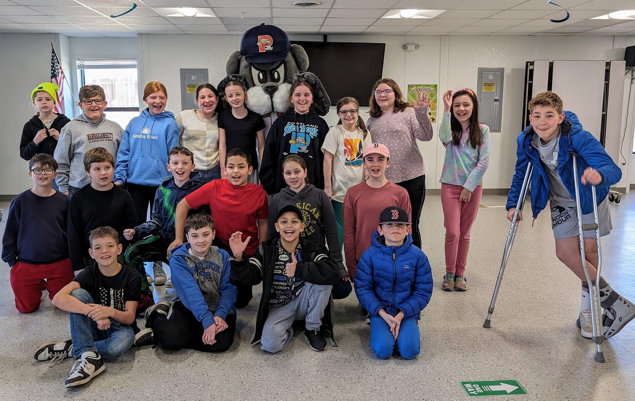 A group of children and adults posing for a picture