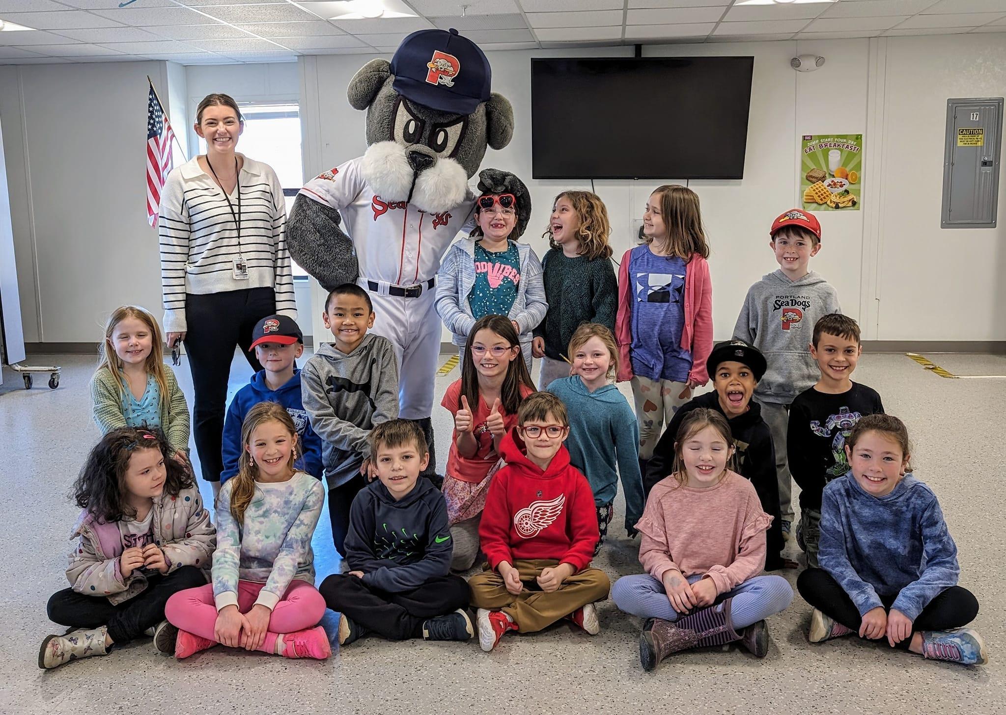 A group of children and adults posing for a picture