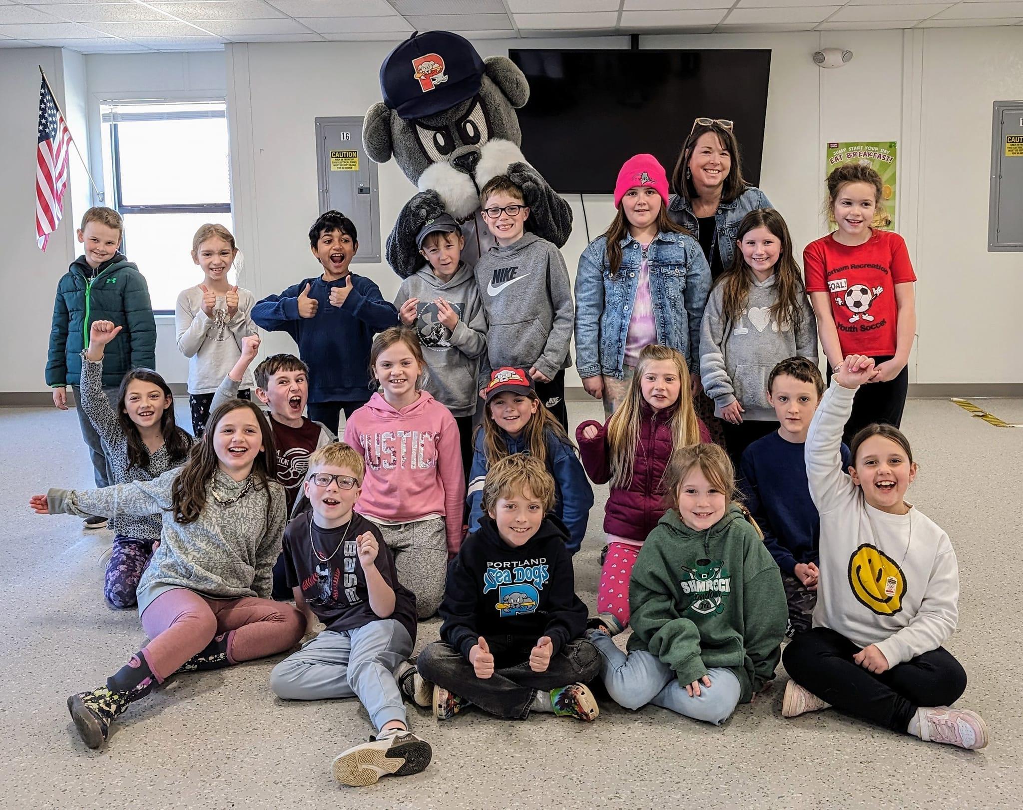 A group of children and adults posing for a picture