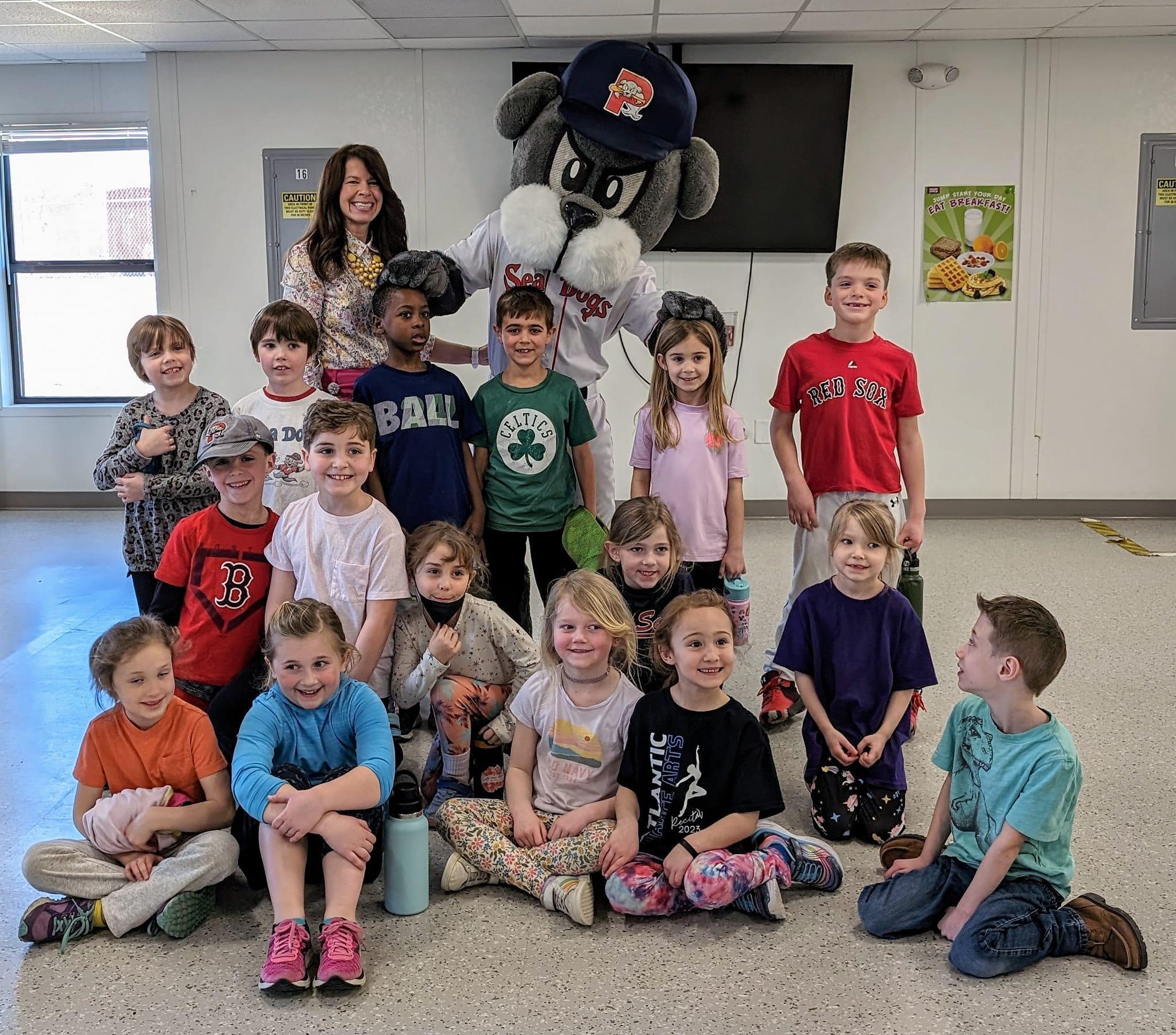 A group of children and adults posing for a picture