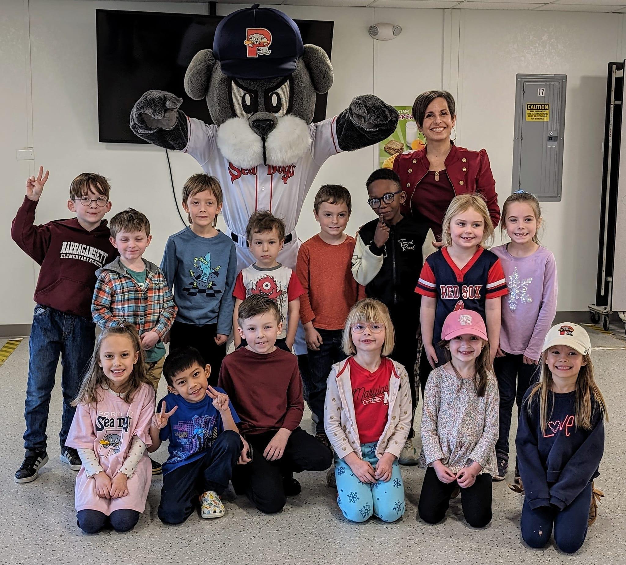 A group of children and adults posing for a picture