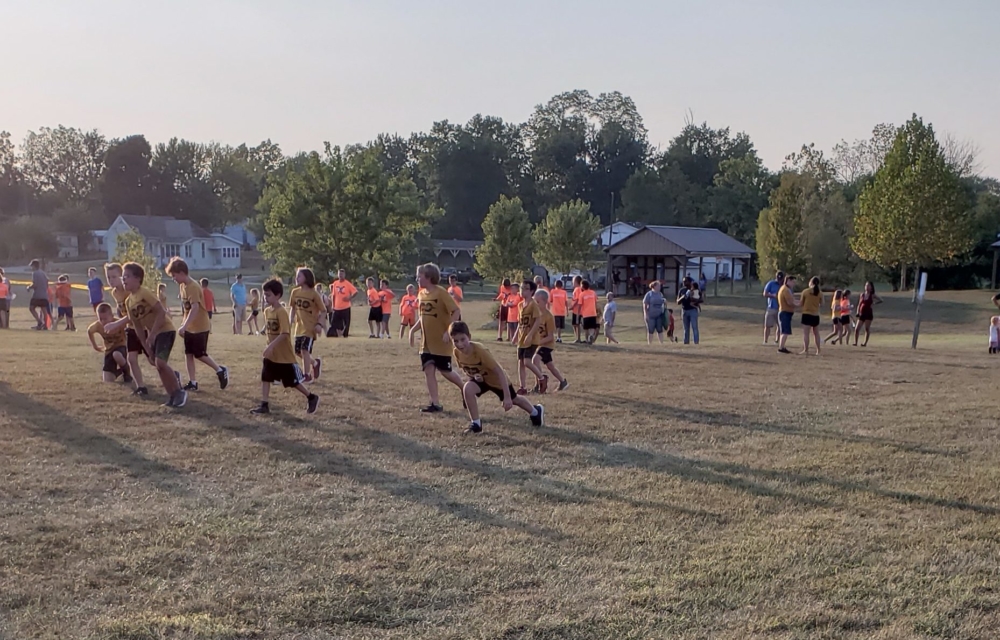 children running in an open field