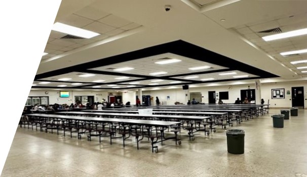 Large open room with lunch tables. 