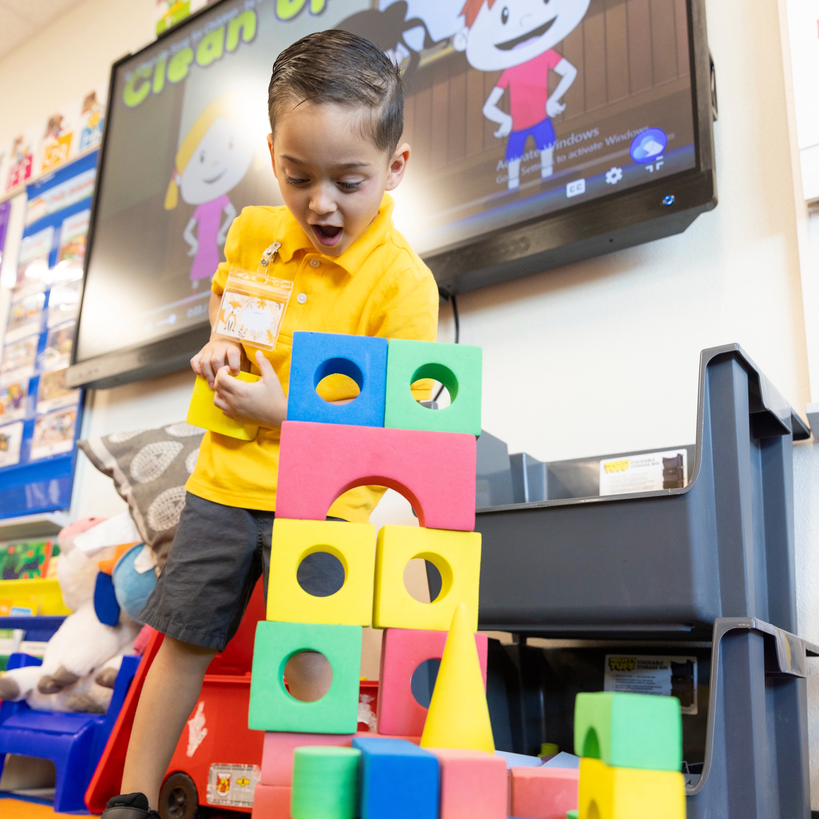 Pre-Kinder student reading a book