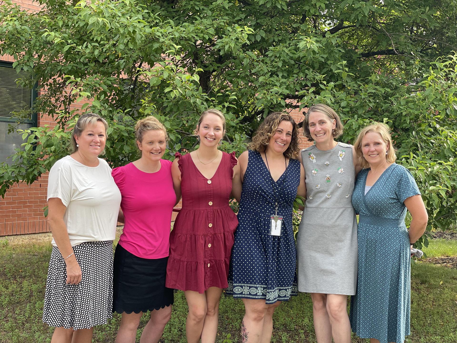 A group of women standing next to each other