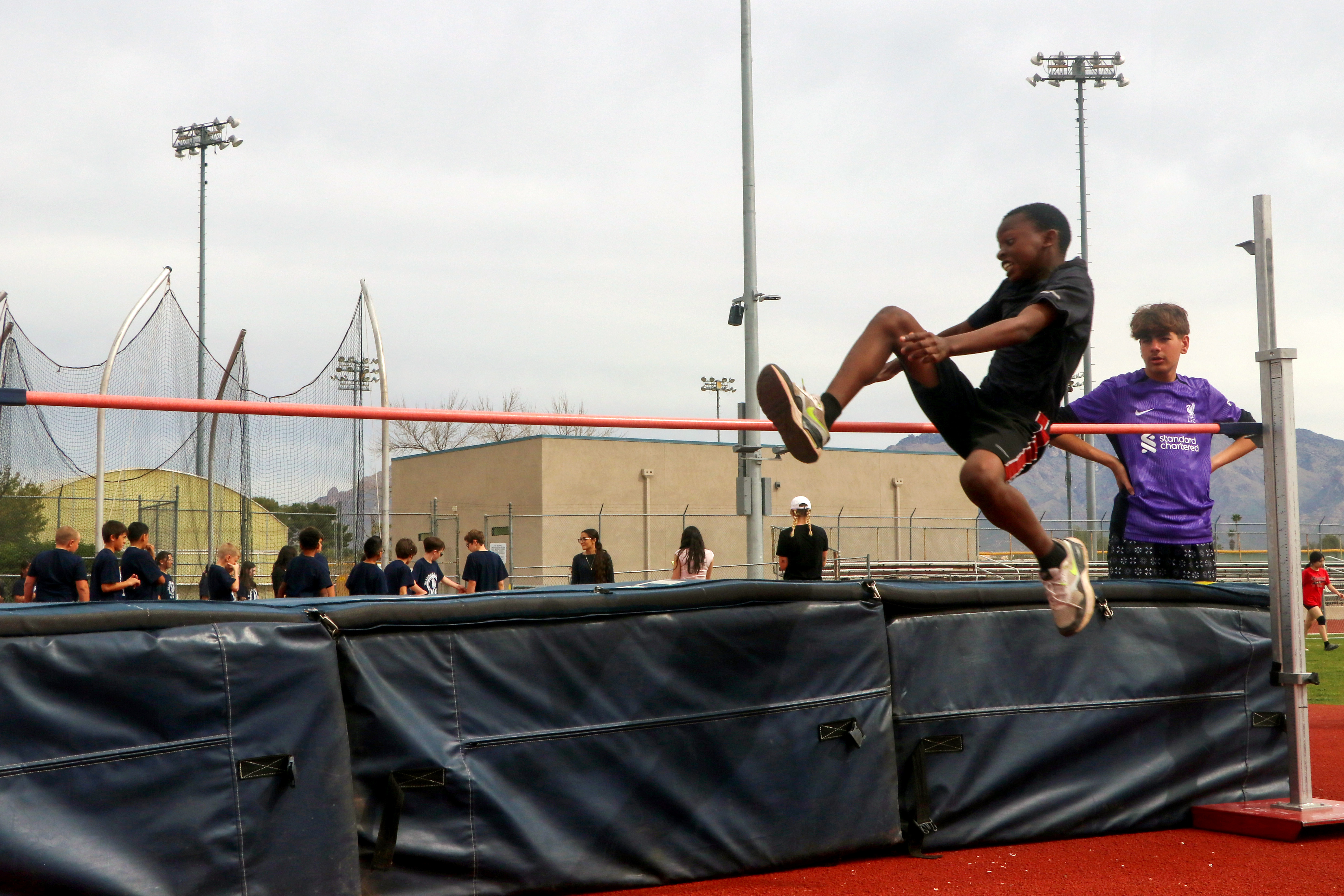 boy participating in high jump