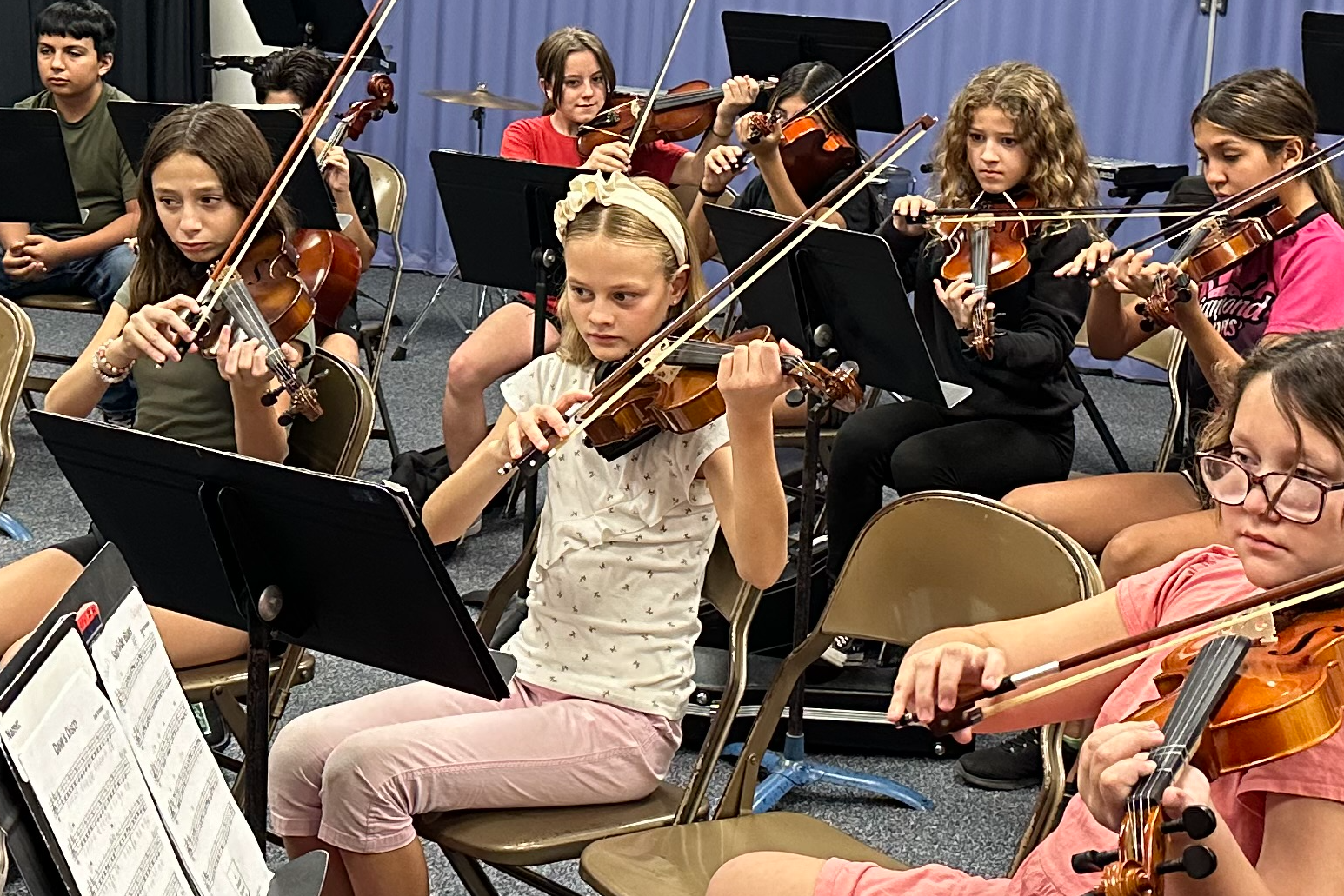 6th grade Orchestra practicing their instruments