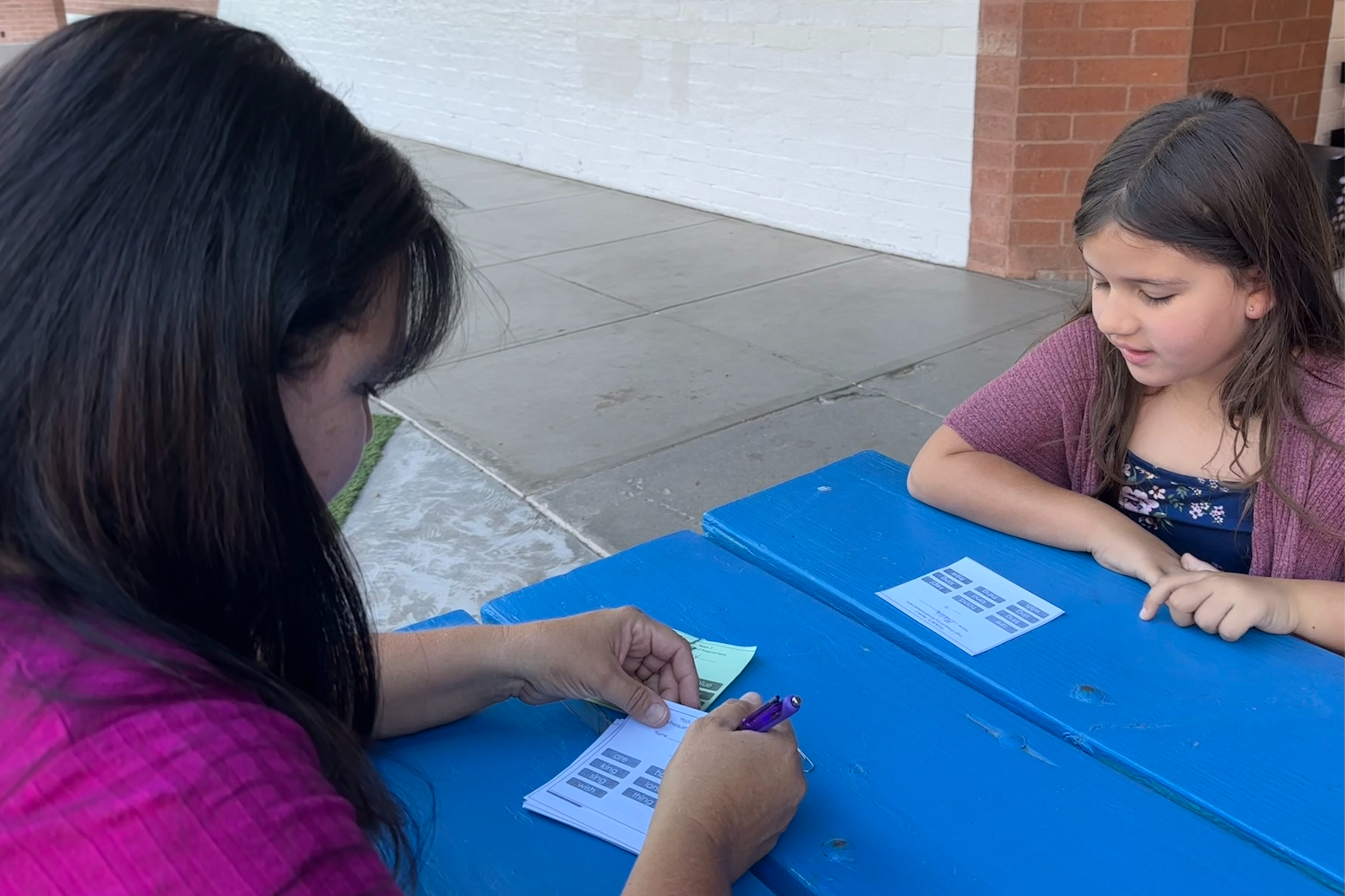 A Teacher Helping a 2nd Grader