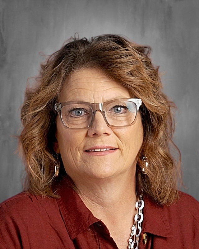 woman with glasses and red shirt