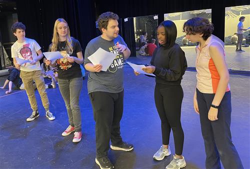 Student actors performing on stage