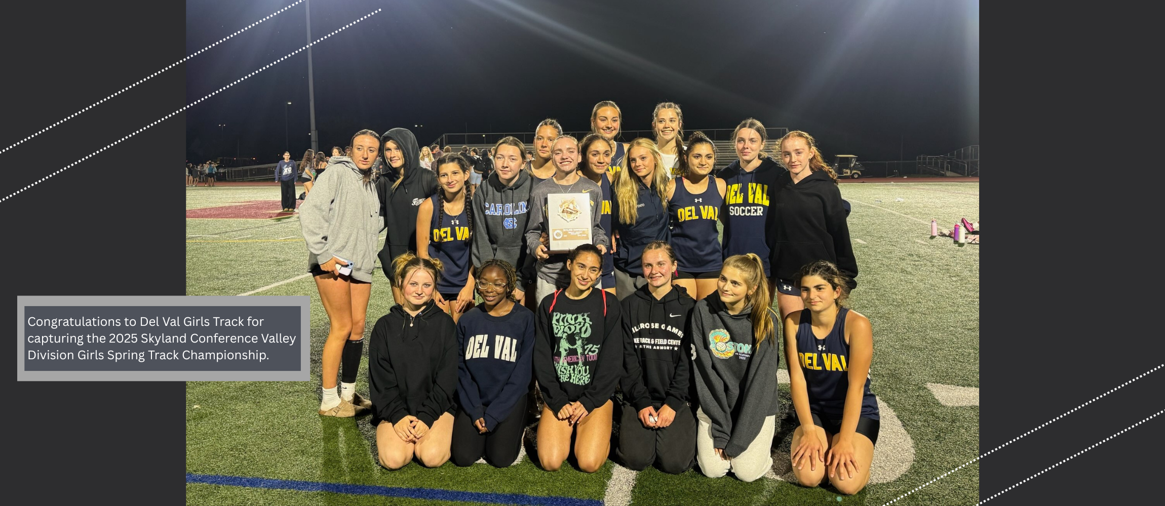 The Del Val Girls Track team poses with their Skyland Conference Valley Division Spring Track Championship plaque.