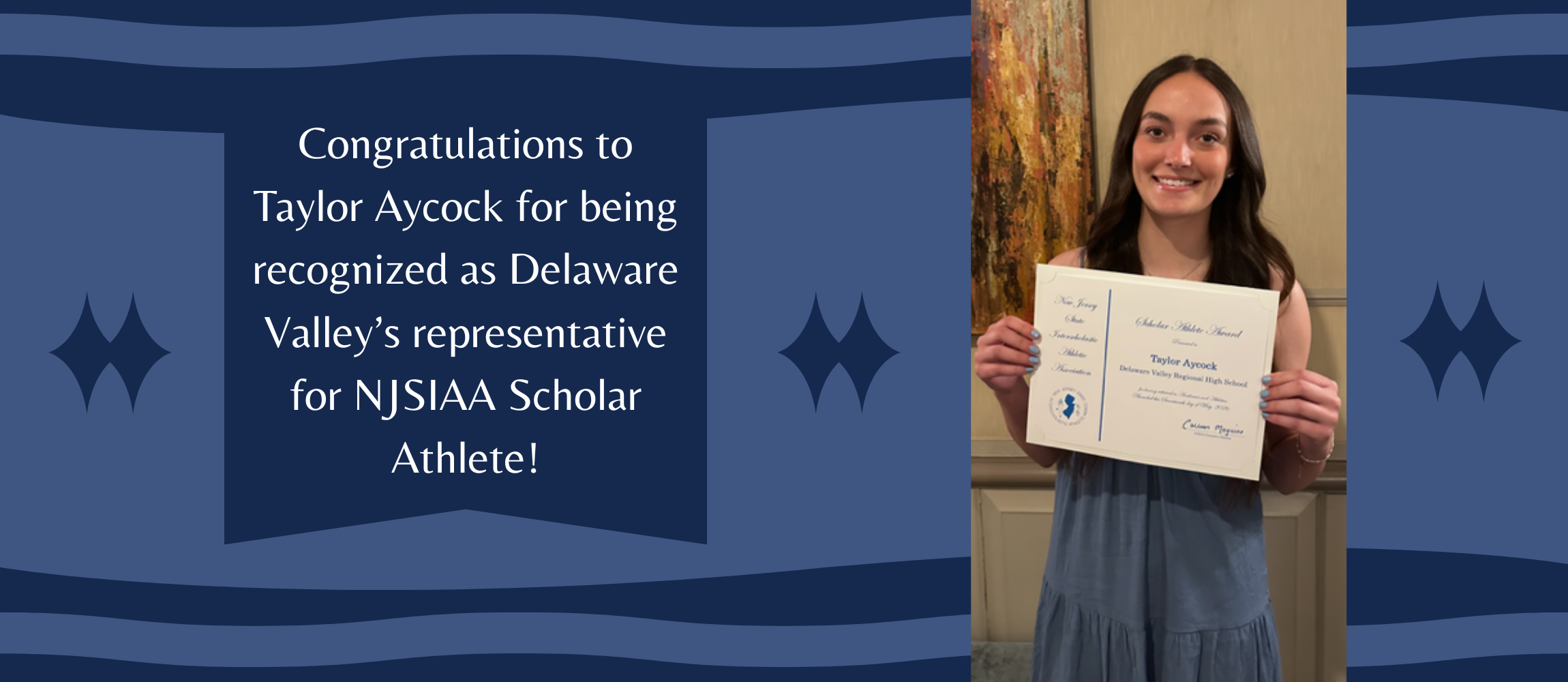 Taylor Aycock poses with her certificate noting her achievement of being nominated as Del Val's NJSIAA Scholar Athlete in a blue dress with beige walls in background.