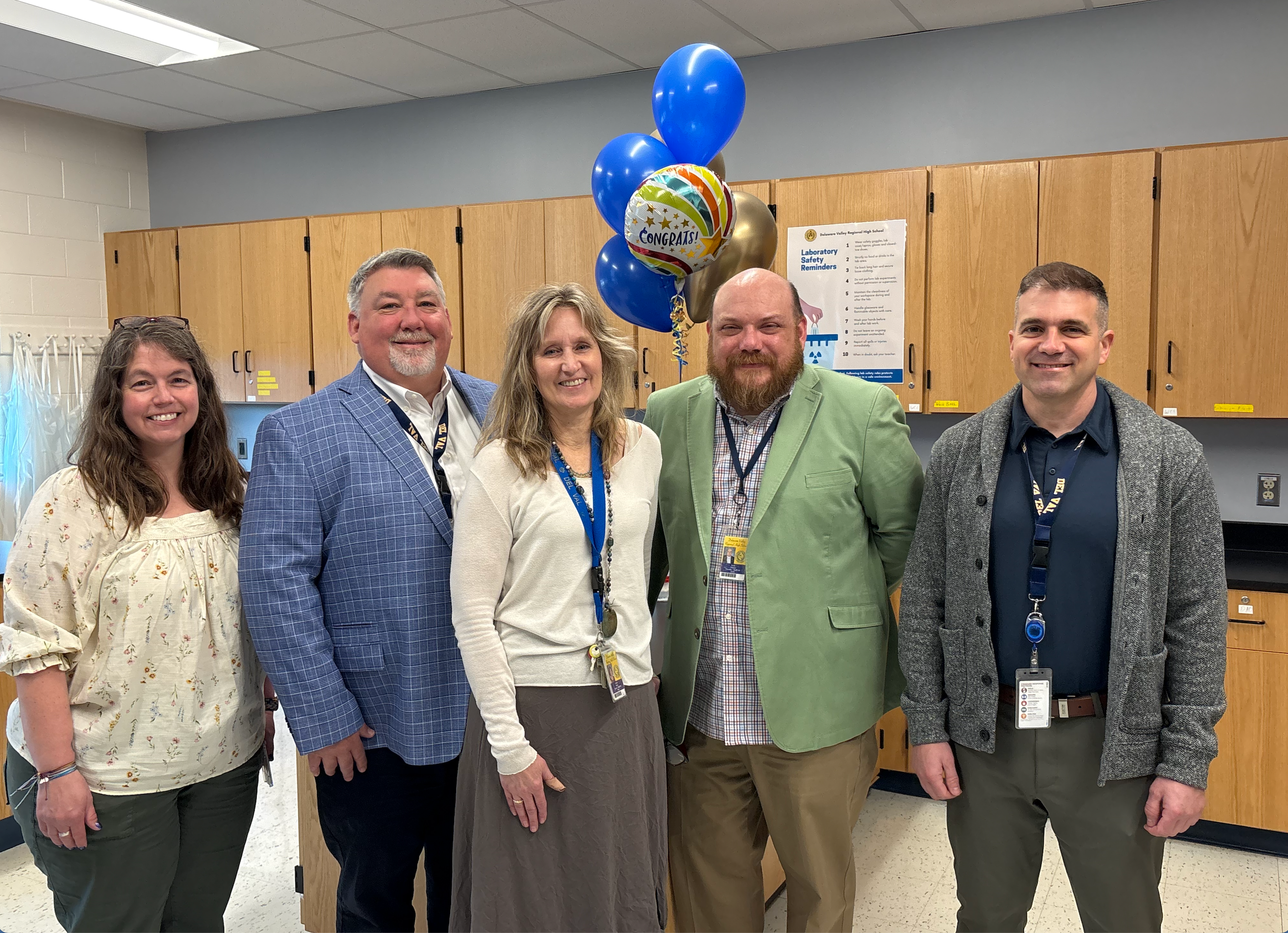 Ms. Grady, Mr. McKinney, Dr. Bowe, Mr. Tinnes, and Mr. Kays pose together in photo to celebrate Dr. Bowe's Teacher of the Year award.