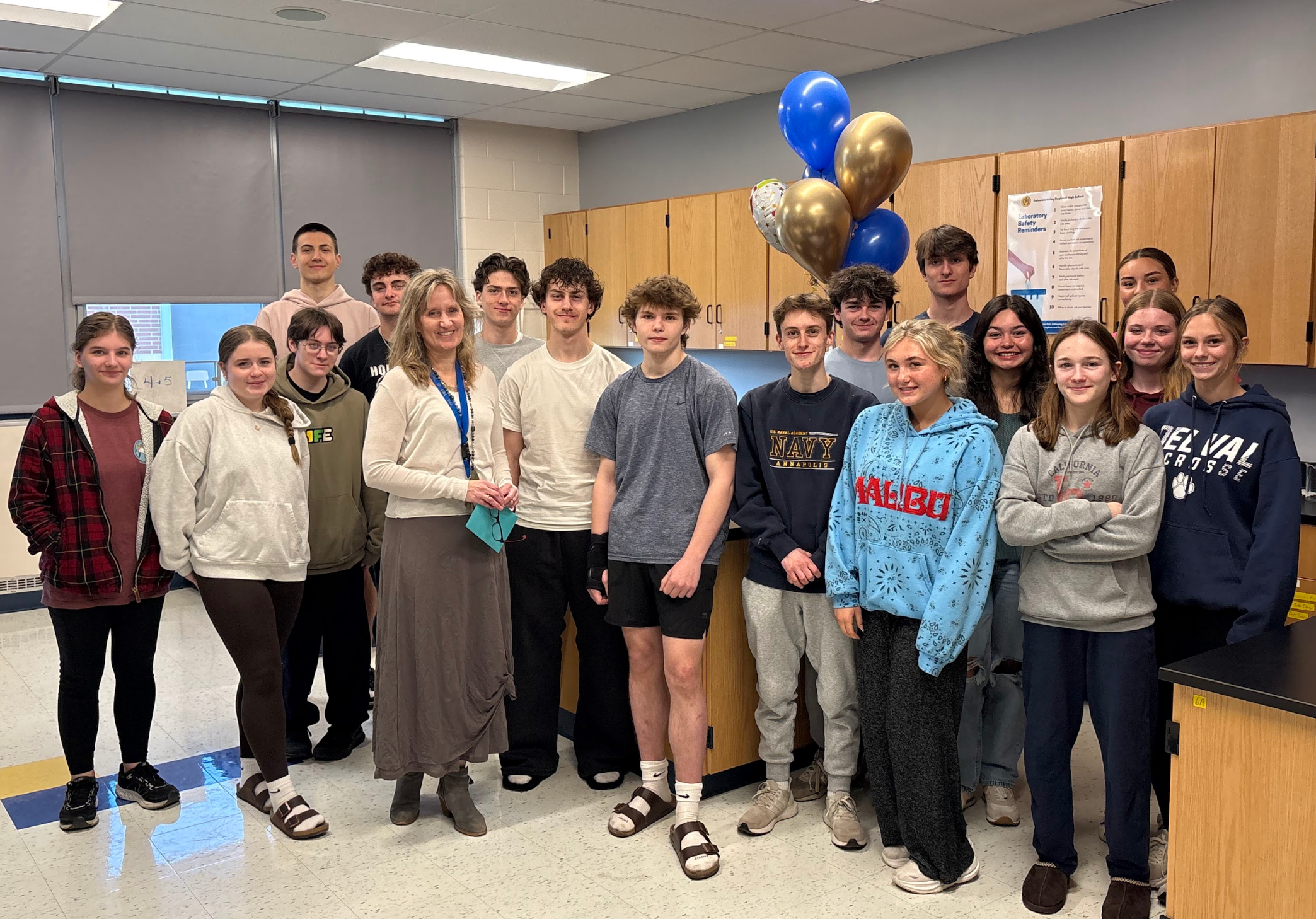 Dr. Bowe's class pose in a group photo to celebrate becoming Educator of the Year at DelVal.