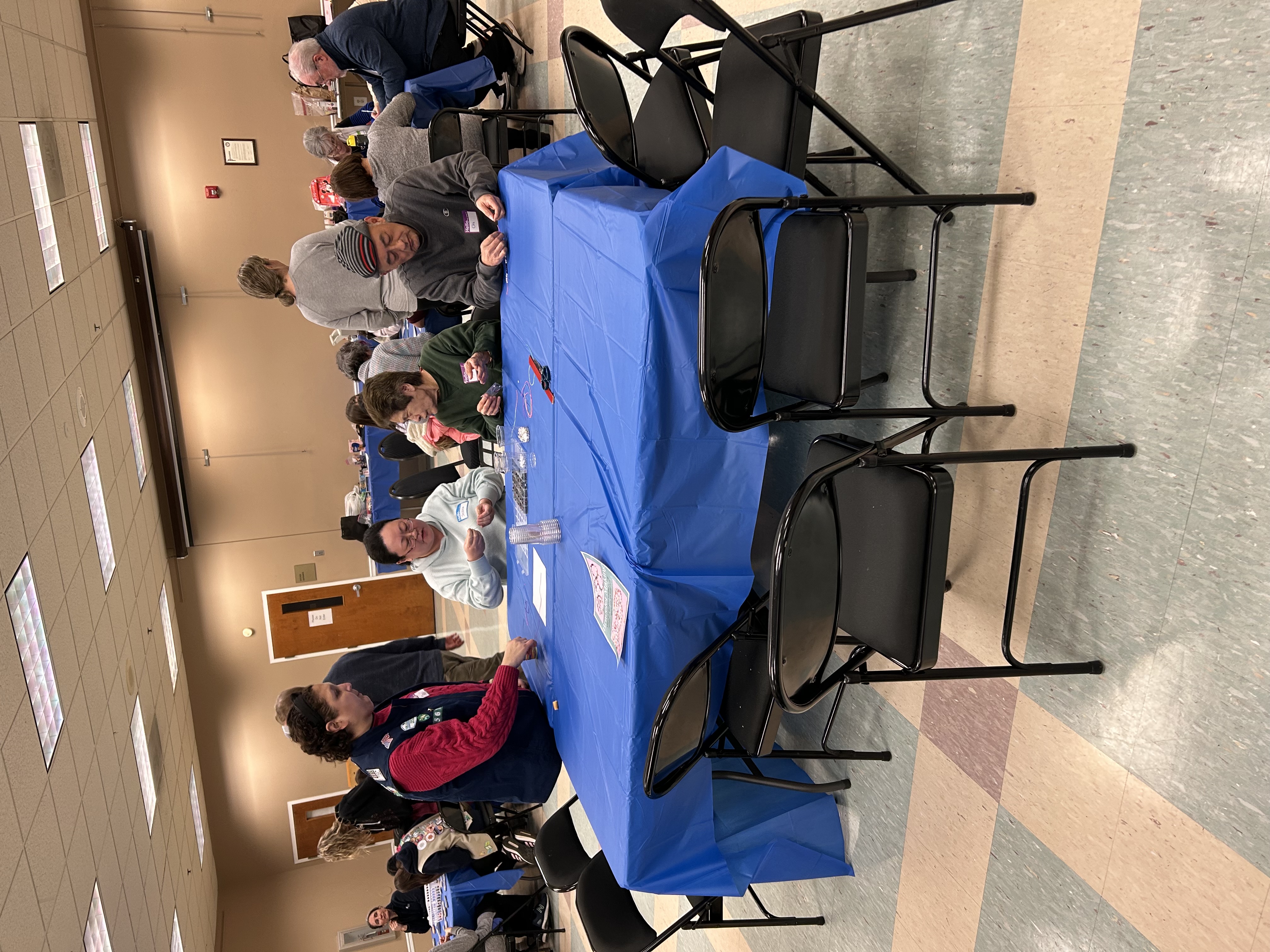 People at a table doing activities
