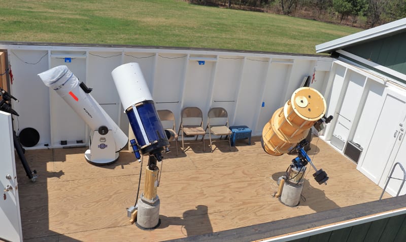 A telescope inside a small building, providing a view of the surrounding area.