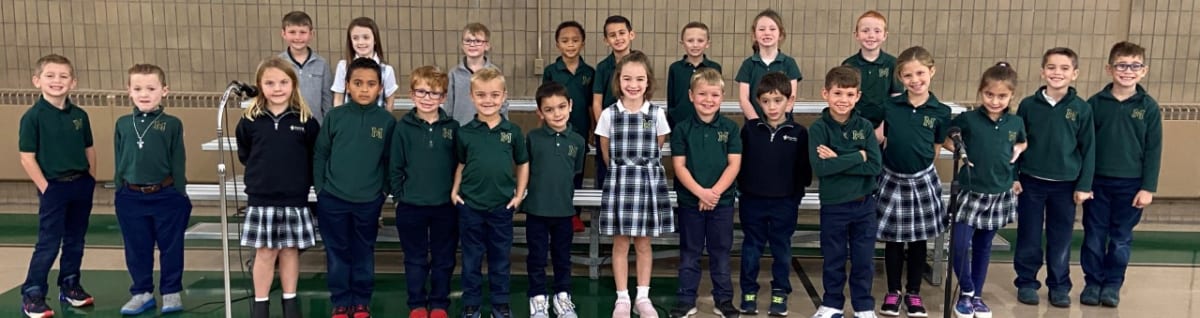 A group photo of young studens wearing their uniforms